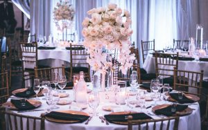 elegant wedding reception table setup in a restaurant with a cozy atmosphere